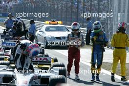 21.08.2005 Istanbul, Turkey, Jarno Trulli, ITA, Toyota, Panasonic Toyota Racing and Fernando Alonso, ESP, Renault F1 Team walk in after the race - August, Formula 1 World Championship, Rd 14, Turkish Grand Prix, Istanbul Park, Turkey