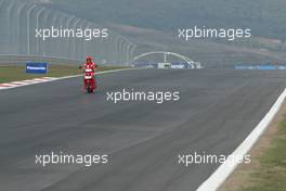 18.08.2005 Istanbul, Turkey, Michael Schumacher, GER, Ferrari looks at the circuit on a scooter - August, Formula 1 World Championship, Rd 14, Turkish Grand Prix, Istanbul Park, Turkey