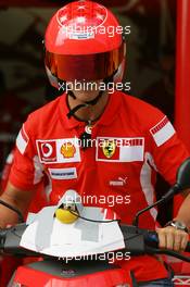 18.08.2005 Istanbul, Turkey, Michael Schumacher, GER, Ferrari views the circuit on a moped - August, Formula 1 World Championship, Rd 14, Turkish Grand Prix, Istanbul Park, Turkey