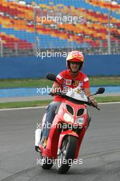 18.08.2005 Istanbul, Turkey, Michael Schumacher, GER, Ferrari views the circuit on a moped - August, Formula 1 World Championship, Rd 14, Turkish Grand Prix, Istanbul Park, Turkey