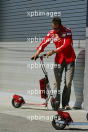 17.06.2005 Indianapolis, USA,  Michael Schumacher, GER, Ferrari with his scooter - June, Formula 1 World Championship, Rd 9, American Grand Prix, Indianapolis, USA