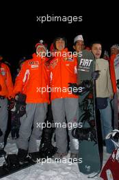 12.01.2005 Madonna di Campiglio, Italy, Michael Schumacher (GER), Scuderia Ferrari Marlboro, Portrait (right) and Luca Badoer (ITA), Test driver Scuderia Ferrari Marlboro, Portrait (left), having a go on a snow board of the FIAT Freestyle Team - Wrooom 2005, 15th annual Ski Press Meeting of Scuderia Ferrari Marlboro in Madonna di Campiglio, The Dolomites, Italy