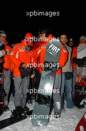 12.01.2005 Madonna di Campiglio, Italy, Michael Schumacher (GER), Scuderia Ferrari Marlboro, Portrait (right) and Luca Badoer (ITA), Test driver Scuderia Ferrari Marlboro, Portrait (left), having a go on a snow board of the FIAT Freestyle Team - Wrooom 2005, 15th annual Ski Press Meeting of Scuderia Ferrari Marlboro in Madonna di Campiglio, The Dolomites, Italy