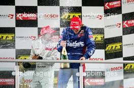 17.09.2005 Klettwitz, Germany,  Podium, Lewis Hamilton (GBR), ASM Formule 3, Dallara F305 Mercedes (1st, left), spraying champaign to Giedo van der Garde (NED), Team Rosberg, Dallara F305 Opel Spiess (2nd, right) - F3 Euro Series 2005 at Lausitzring