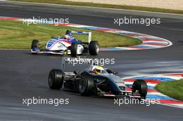 17.09.2005 Klettwitz, Germany,  Lewis Hamilton (GBR), ASM Formule 3, Dallara F305 Mercedes, leading the race, after having taken over the lead from Giedo van der Garde (NED), Team Rosberg, Dallara F305 Opel Spiess - F3 Euro Series 2005 at Lausitzring