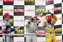 22.10.2005 Hockenheim, Germany,  Podium, champaign for Lewis Hamilton (GBR), ASM Formule 3, Dallara F305 Mercedes (1st, center), Maximilian Götz (GER), ASM Formule 3, Dallara F305 Mercedes (3rd, left) and Lucas di Grassi (BRA), Manor Motorsport, Dallara F305 Mercedes (2nd, right) - F3 Euro Series 2005 at Hockenheimring