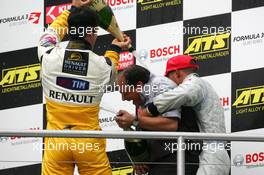 22.10.2005 Hockenheim, Germany,  Podium, ASM mechanic getting a champaign shower from Lucas di Grassi (BRA), Manor Motorsport, Dallara F305 Mercedes (2nd, left) and Lewis Hamilton (GBR), ASM Formule 3, Dallara F305 Mercedes (1st, right) - F3 Euro Series 2005 at Hockenheimring