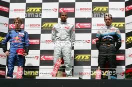 07.08.2005 Nürburg, Germany,  Podium, Lewis Hamilton (GBR), ASM Formule 3, Dallara F305 Mercedes (1st, center), Sebastian Vettel (GER), ASL Mücke Motorsport, Dallara F305 Mercedes (2nd, left) and Adrian Sutil (GER), ASM Formule 3, Dallara F305 Mercedes (3rd) - F3 Euro Series 2005 at Nürburgring