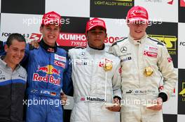 16.07.2005 Nürnberg, Germany,  Podium, Lewis Hamilton (GBR), ASM Formule 3, Dallara F305 Mercedes (1st, center), Sebastian Vettel (GER), ASL Mücke Motorsport, Dallara F305 Mercedes (2nd, left) and Paul di Resta (GBR), Manor Motorsport, Dallara F305 Mercedes (3rd, right) - F3 Euro Series 2005 at Norisring