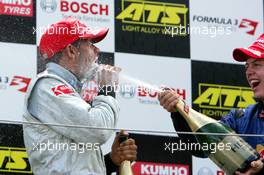 28.08.2005 Zandvoort, The Netherlands,  Podium, Lewis Hamilton (GBR), ASM Formule 3, Dallara F305 Mercedes (1st, left), gets a champaign shower from Sebastian Vettel (GER), ASL Mücke Motorsport, Dallara F305 Mercedes (2nd, right) - F3 Euro Series 2005 at Circuit Park Zandvoort