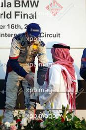 16.12.2005 Sakhir, Bahrain, Formula BMW World Final 2005, 13th to 16th December, Bahrain International Circuit, Podium - The Crown Prince Shaikh Salman Bin Hamad Al Khalifa and Nicolas Huelkenberg, GER, Josef Kaufmann Racing - For further information please register at www.press.bmw.de - This image is free for editorial use only. Please use for Copyright/Credit: c BMW AG