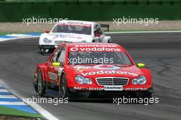 09.04.2006 Hockenheim, Germany,  Bernd Schneider (GER), AMG-Mercedes, AMG-Mercedes C-Klasse, leads the race in front of Stefan Mücke (GER), Mücke Motorsport, AMG-Mercedes C-Klasse - DTM 2006 at Hockenheimring (Deutsche Tourenwagen Masters)