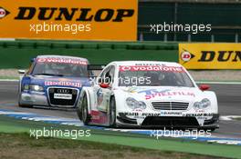 09.04.2006 Hockenheim, Germany,  Stefan Mücke (GER), Mücke Motorsport, AMG-Mercedes C-Klasse, leads Mattias Ekström (SWE), Audi Sport Team Abt Sportsline, Audi A4 DTM - DTM 2006 at Hockenheimring (Deutsche Tourenwagen Masters)