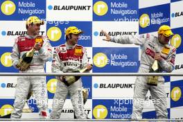 09.04.2006 Hockenheim, Germany,  Bernd Schneider (GER), AMG-Mercedes, AMG-Mercedes C-Klasse receiving a champagne shower on the podium. - DTM 2006 at Hockenheimring (Deutsche Tourenwagen Masters)