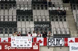 28.04.2006 Klettwitz, Germany,  Fans of Bernd Schneider (GER), AMG-Mercedes, AMG-Mercedes C-Klasse waiting on the empty grandstand to see their idol. - DTM 2006 at Eurospeedway Lausitzring (Deutsche Tourenwagen Masters)