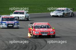 30.04.2006 Klettwitz, Germany,  Bernd Schneider (GER), AMG-Mercedes, AMG-Mercedes C-Klasse, leading the race in front of Mattias Ekström (SWE), Audi Sport Team Abt Sportsline, Audi A4 DTM (retired), Tom Kristensen (DNK), Audi Sport Team Abt Sportsline, Audi A4 DTM and Mika Häkkinen (FIN), AMG-Mercedes, AMG-Mercedes C-Klasse - DTM 2006 at Eurospeedway Lausitzring (Deutsche Tourenwagen Masters)