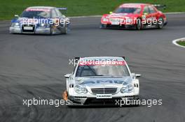 30.04.2006 Klettwitz, Germany,  Mika Häkkinen (FIN), AMG-Mercedes, AMG-Mercedes C-Klasse, leads Mattias Ekström (SWE), Audi Sport Team Abt Sportsline, Audi A4 DTM and Bernd Schneider (GER), AMG-Mercedes, AMG-Mercedes C-Klasse - DTM 2006 at Eurospeedway Lausitzring (Deutsche Tourenwagen Masters)