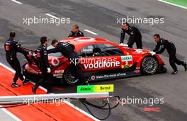 30.04.2006 Klettwitz, Germany,  Bernd Schneider (GER), AMG-Mercedes, AMG-Mercedes C-Klasse being pushed back by the pitcrew into his pitbox - DTM 2006 at Eurospeedway Lausitzring (Deutsche Tourenwagen Masters)