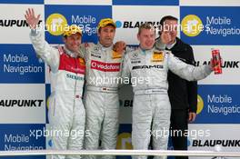 30.04.2006 Klettwitz, Germany,  Podium, Bernd Schneider (GER), AMG-Mercedes, Portrait (1st, center), Tom Kristensen (DNK), Audi Sport Team Abt Sportsline, Portrait (2nd, left) and Mika Häkkinen (FIN), AMG-Mercedes, Portrait (3rd, right) - DTM 2006 at Eurospeedway Lausitzring (Deutsche Tourenwagen Masters)