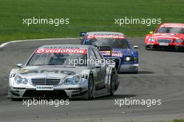 30.04.2006 Klettwitz, Germany,  Mika Häkkinen (FIN), AMG-Mercedes, AMG-Mercedes C-Klasse, leads Mattias Ekström (SWE), Audi Sport Team Abt Sportsline, Audi A4 DTM and Bernd Schneider (GER), AMG-Mercedes, AMG-Mercedes C-Klasse - DTM 2006 at Eurospeedway Lausitzring (Deutsche Tourenwagen Masters)