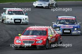 30.04.2006 Klettwitz, Germany,  Bernd Schneider (GER), AMG-Mercedes, AMG-Mercedes C-Klasse, leading the race, in front of Mattias Ekström (SWE), Audi Sport Team Abt Sportsline, Audi A4 DTM (retired), Tom Kristensen (DNK), Audi Sport Team Abt Sportsline, Audi A4 DTM and Mika Häkkinen (FIN), AMG-Mercedes, AMG-Mercedes C-Klasse - DTM 2006 at Eurospeedway Lausitzring (Deutsche Tourenwagen Masters)