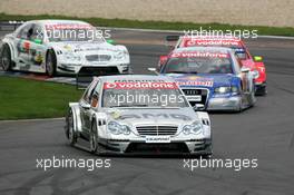 30.04.2006 Klettwitz, Germany,  Mika Häkkinen (FIN), AMG-Mercedes, AMG-Mercedes C-Klasse, leads Mattias Ekström (SWE), Audi Sport Team Abt Sportsline, Audi A4 DTM, Bernd Schneider (GER), AMG-Mercedes, AMG-Mercedes C-Klasse and Jamie Green (GBR), AMG-Mercedes, AMG-Mercedes C-Klasse - DTM 2006 at Eurospeedway Lausitzring (Deutsche Tourenwagen Masters)