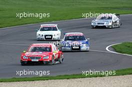 30.04.2006 Klettwitz, Germany,  Bernd Schneider (GER), AMG-Mercedes, AMG-Mercedes C-Klasse, leads the race in front of Mattias Ekström (SWE), Audi Sport Team Abt Sportsline, Audi A4 DTM (retired), Tom Kristensen (DNK), Audi Sport Team Abt Sportsline, Audi A4 DTM and Mika Häkkinen (FIN), AMG-Mercedes, AMG-Mercedes C-Klasse - DTM 2006 at Eurospeedway Lausitzring (Deutsche Tourenwagen Masters)