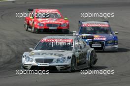 30.04.2006 Klettwitz, Germany,  Mika Häkkinen (FIN), AMG-Mercedes, AMG-Mercedes C-Klasse, leading the race in front of Mattias Ekström (SWE), Audi Sport Team Abt Sportsline, Audi A4 DTM (retired) and Bernd Schneider (GER), AMG-Mercedes, AMG-Mercedes C-Klasse - DTM 2006 at Eurospeedway Lausitzring (Deutsche Tourenwagen Masters)