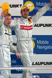 30.04.2006 Klettwitz, Germany,  Podium, Mika Häkkinen (FIN), AMG-Mercedes, Portrait (3rd, left) and Bernd Schneider (GER), AMG-Mercedes, Portrait (1st, right) - DTM 2006 at Eurospeedway Lausitzring (Deutsche Tourenwagen Masters)