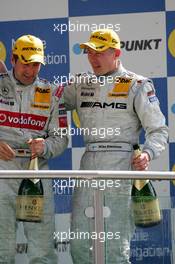 30.04.2006 Klettwitz, Germany,  Podium, Mika Häkkinen (FIN), AMG-Mercedes, Portrait (3rd, right), with Bernd Schneider (GER), AMG-Mercedes, AMG-Mercedes C-Klasse (1st, left) - DTM 2006 at Eurospeedway Lausitzring (Deutsche Tourenwagen Masters)