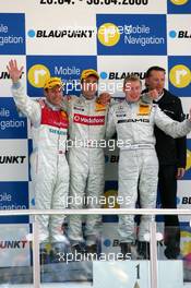 30.04.2006 Klettwitz, Germany,  Podium, Bernd Schneider (GER), AMG-Mercedes, Portrait (1st, center), Tom Kristensen (DNK), Audi Sport Team Abt Sportsline, Portrait (2nd, left), Mika Häkkinen (FIN), AMG-Mercedes, Portrait (3rd, right) and Hans-Jürgen Mattheis (GER), Team Manager HWA (background) - DTM 2006 at Eurospeedway Lausitzring (Deutsche Tourenwagen Masters)