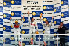 30.04.2006 Klettwitz, Germany,  Podium DTM : (left) Tom Kristensen (DNK), Audi Sport Team Abt Sportsline, Audi A4 DTM ( 2nd), (middle) Bernd Schneider (GER), AMG-Mercedes, AMG-Mercedes C-Klasse (1st); Mika Häkkinen (FIN), AMG-Mercedes, AMG-Mercedes C-Klasse (3rd); Hans-Jürgen Mattheis (GER), Team Manager HWA. - DTM 2006 at Eurospeedway Lausitzring (Deutsche Tourenwagen Masters)