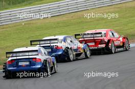 21.05.2006 Oschersleben, Germany,  Bernd Schneider (GER), AMG-Mercedes, AMG-Mercedes C-Klasse, in front of Martin Tomczyk (GER), Audi Sport Team Abt Sportsline, Audi A4 DTM and Mattias Ekström (SWE), Audi Sport Team Abt Sportsline, Audi A4 DTM - DTM 2006 at Motorsport Arena Oschersleben (Deutsche Tourenwagen Masters)