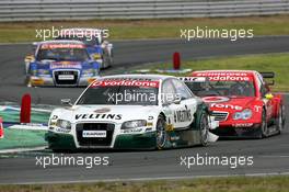 21.05.2006 Oschersleben, Germany,  Heinz-Harald Frentzen (GER), Audi Sport Team Abt Sportsline, Audi A4 DTM, leads Bernd Schneider (GER), AMG-Mercedes, AMG-Mercedes C-Klasse, Martin Tomczyk (GER), Audi Sport Team Abt Sportsline, Audi A4 DTM and Mattias Ekström (SWE), Audi Sport Team Abt Sportsline, Audi A4 DTM - DTM 2006 at Motorsport Arena Oschersleben (Deutsche Tourenwagen Masters)