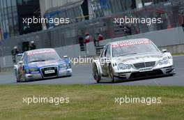 21.05.2006 Oschersleben, Germany,  Mika Häkkinen (FIN), AMG-Mercedes, AMG-Mercedes C-Klasse in front of Mattias Ekström (SWE), Audi Sport Team Abt Sportsline, Audi A4 DTM on the straight. - DTM 2006 at Motorsport Arena Oschersleben (Deutsche Tourenwagen Masters)