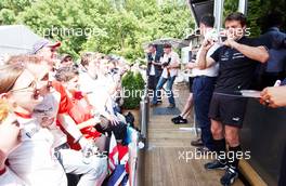 01.07.2006 Fawkham, England,  Bernd Schneider (GER), AMG-Mercedes, AMG-Mercedes C-Klasse having a joke with the audience at the public pressconference of Mercedes Benz. He took a camera from someone out of the audience and made a picture with it. - DTM 2006 at Brands Hatch, England (Deutsche Tourenwagen Masters)