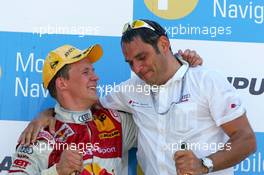 02.07.2006 Fawkham, England,  Podium, Mattias Ekström (SWE), Audi Sport Team Abt Sportsline, Portrait (1st, left) and Hans-Jurgen Abt (GER), Teamchef Abt-Audi (right) - DTM 2006 at Brands Hatch, England (Deutsche Tourenwagen Masters)