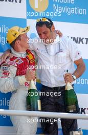 02.07.2006 Fawkham, England,  Mattias Ekström (SWE), Audi Sport Team Abt Sportsline, Audi A4 DTM having some personal words at the podium with Hans-Jurgen Abt (GER), Teamchef Abt-Audi - DTM 2006 at Brands Hatch, England (Deutsche Tourenwagen Masters)