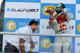 02.07.2006 Fawkham, England,  Podium, Mattias Ekström (SWE), Audi Sport Team Abt Sportsline, Portrait (1st), spraying champaign on Hans-Jurgen Abt (GER), Teamchef Abt-Audi - DTM 2006 at Brands Hatch, England (Deutsche Tourenwagen Masters)