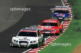 02.07.2006 Fawkham, England,  Heinz-Harald Frentzen (GER), Audi Sport Team Abt Sportsline, Audi A4 DTM, leads Bernd Schneider (GER), AMG-Mercedes, AMG-Mercedes C-Klasse and Martin Tomczyk (GER), Audi Sport Team Abt Sportsline, Audi A4 DTM - DTM 2006 at Brands Hatch, England (Deutsche Tourenwagen Masters)