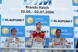 02.07.2006 Fawkham, England,  Podium, Mattias Ekström (SWE), Audi Sport Team Abt Sportsline, Portrait (1st, center), Jamie Green (GBR), AMG-Mercedes, Portrait (2nd, left) and Bernd Schneider (GER), AMG-Mercedes, AMG-Mercedes C-Klasse (3rd, right) - DTM 2006 at Brands Hatch, England (Deutsche Tourenwagen Masters)