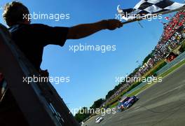 02.07.2006 Fawkham, England,  Mattias Ekström (SWE), Audi Sport Team Abt Sportsline, Audi A4 DTM, taking the chequered flag, being waved by Damon Hill (GBR) - DTM 2006 at Brands Hatch, England (Deutsche Tourenwagen Masters)