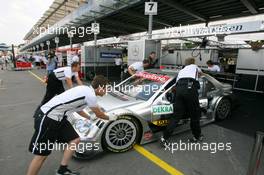 21.07.2006 Nurnberg, Germany,  Mechanics push the car of Mika Häkkinen (FIN), AMG-Mercedes, AMG-Mercedes C-Klasse, back into the pits - DTM 2006 at Norisring (Deutsche Tourenwagen Masters)