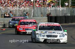 23.07.2006 Nurnberg, Germany,  Jamie Green (GBR), AMG-Mercedes, AMG-Mercedes C-Klasse, leads Bernd Schneider (GER), AMG-Mercedes, AMG-Mercedes C-Klasse and Bruno Spengler (CDN), AMG-Mercedes, AMG-Mercedes C-Klasse - DTM 2006 at Norisring (Deutsche Tourenwagen Masters)