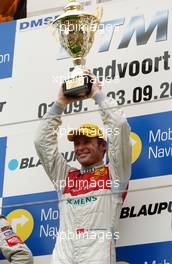 03.09.2006 Zandvoort, The Netherlands,  Winner Tom Kristensen (DNK), Audi Sport Team Abt Sportsline, Audi A4 DTM holding the trophy. - DTM 2006 at Zandvoort, The Netherlands (Deutsche Tourenwagen Masters)