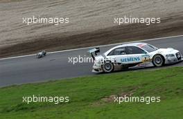 03.09.2006 Zandvoort, The Netherlands,  Tom Kristensen (DNK), Audi Sport Team Abt Sportsline, Audi A4 DTM leaving the pitlane after the first pitstop when the refuelling can stuck on the side of the bodywork. Eventually the can naturally seperated in the Tarzan corner. - DTM 2006 at Zandvoort, The Netherlands (Deutsche Tourenwagen Masters)
