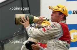 03.09.2006 Zandvoort, The Netherlands,  Winner Tom Kristensen (DNK), Audi Sport Team Abt Sportsline, Audi A4 DTM drinking the champagne. - DTM 2006 at Zandvoort, The Netherlands (Deutsche Tourenwagen Masters)