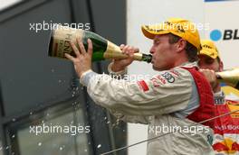 03.09.2006 Zandvoort, The Netherlands,  Winner Tom Kristensen (DNK), Audi Sport Team Abt Sportsline, Audi A4 DTM drinking some champagne. - DTM 2006 at Zandvoort, The Netherlands (Deutsche Tourenwagen Masters)