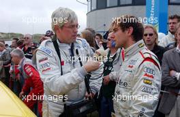 03.09.2006 Zandvoort, The Netherlands,  (right) Jeroen Bleekemolen being interviewed by Dutch radio press after he drove the journalist on an Audi taxiride. - DTM 2006 at Zandvoort, The Netherlands (Deutsche Tourenwagen Masters)