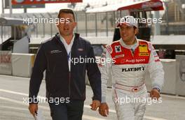 13.10.2006 Le Mans, France,  (right) Christian Abt (GER), Audi Sport Team Phoenix, Audi A4 DTM with an Audi teammember walking down the pitlane. - DTM 2006 at Le Mans Bugatti Circuit, France (Deutsche Tourenwagen Masters)